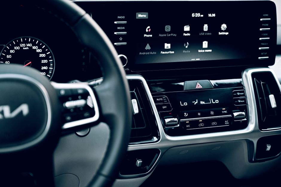 Close-up view of a luxury car's dashboard featuring a modern touchscreen display and advanced features.