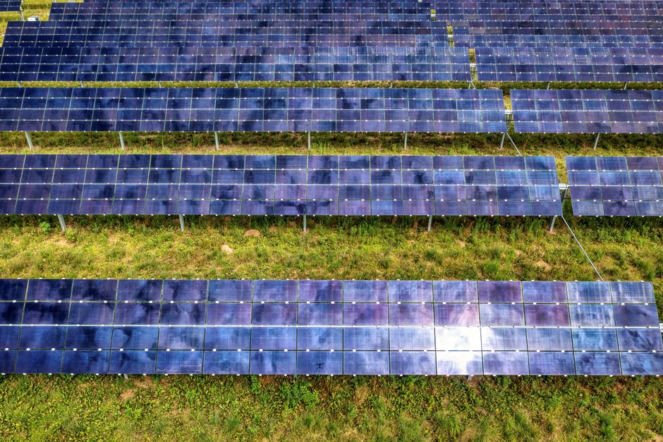 Drone shot of solar panel rows at a solar farm in Kellogg, MN, showcasing sustainable energy technology.