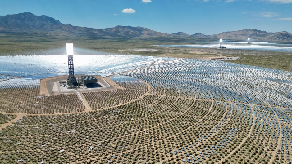 Aerial view of a vast solar power plant in the Mojave Desert, highlighting renewable energy.