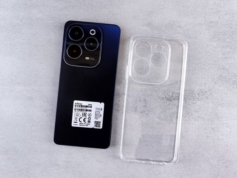 Top view of Infinix Hot 40 Pro smartphone with transparent clear case on a light background.