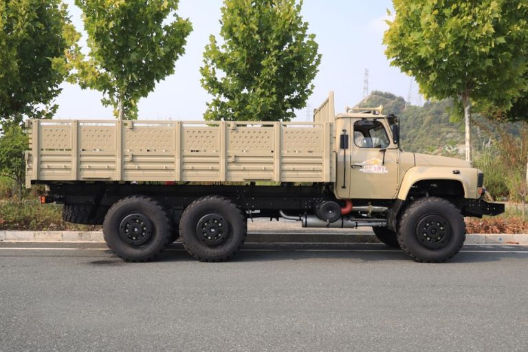 A robust all-terrain truck parked on a road, surrounded by greenery in Myanmar.