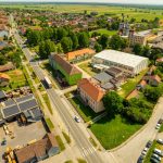 Aerial view of the village Hercegovac, showing streets and buildings on a sunny day.