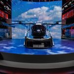 Flying car exhibit at automotive event in São Paulo showcasing innovation in transport technology.