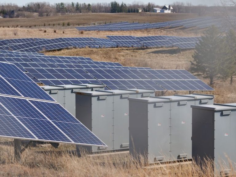 Expansive solar panel field in a rural area harnessing solar energy. Sustainable and renewable energy source.