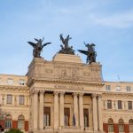 Front view of Spain’s Ministry of Agriculture with angel statues atop in Madrid.