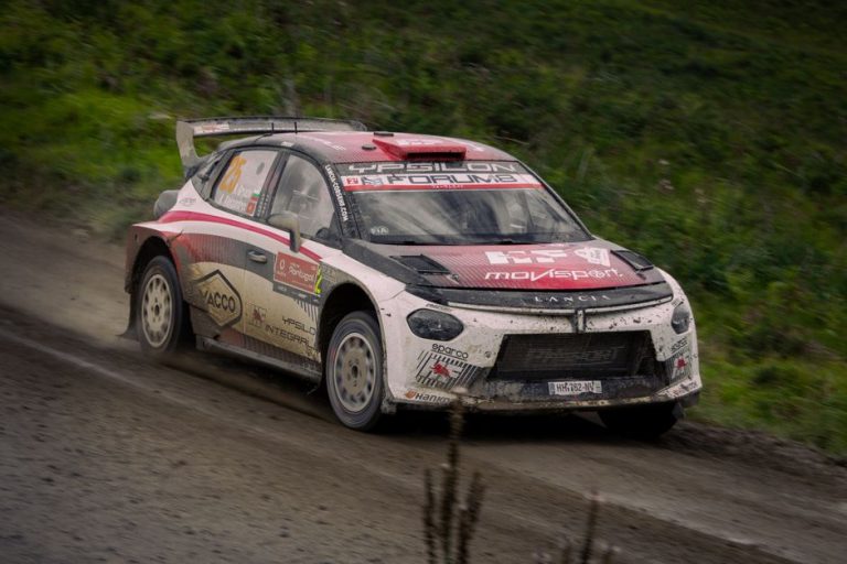 Rally car racing on a muddy track, showcasing speed and agility. Perfect for motorsport enthusiasts.