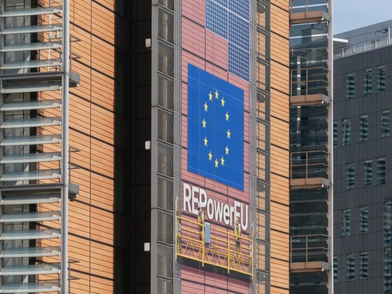 The European Commission building features a REPowerEU banner with EU flag in Brussels.