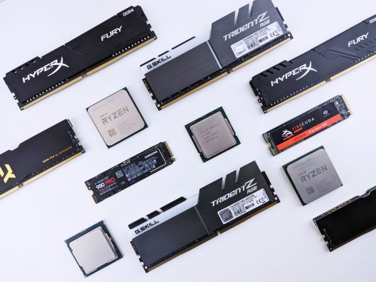 High-quality image of various computer components, including RAM and CPUs, on a white background.