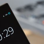 Focused image of a smartphone showing a 10:29 time with blurred background.